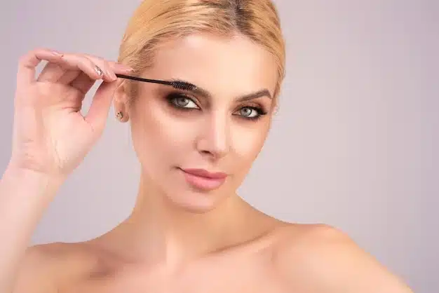 Confident individual showing healthy skin after brow lift