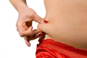 Woman undergoing love handle liposuction for a slimmer waist