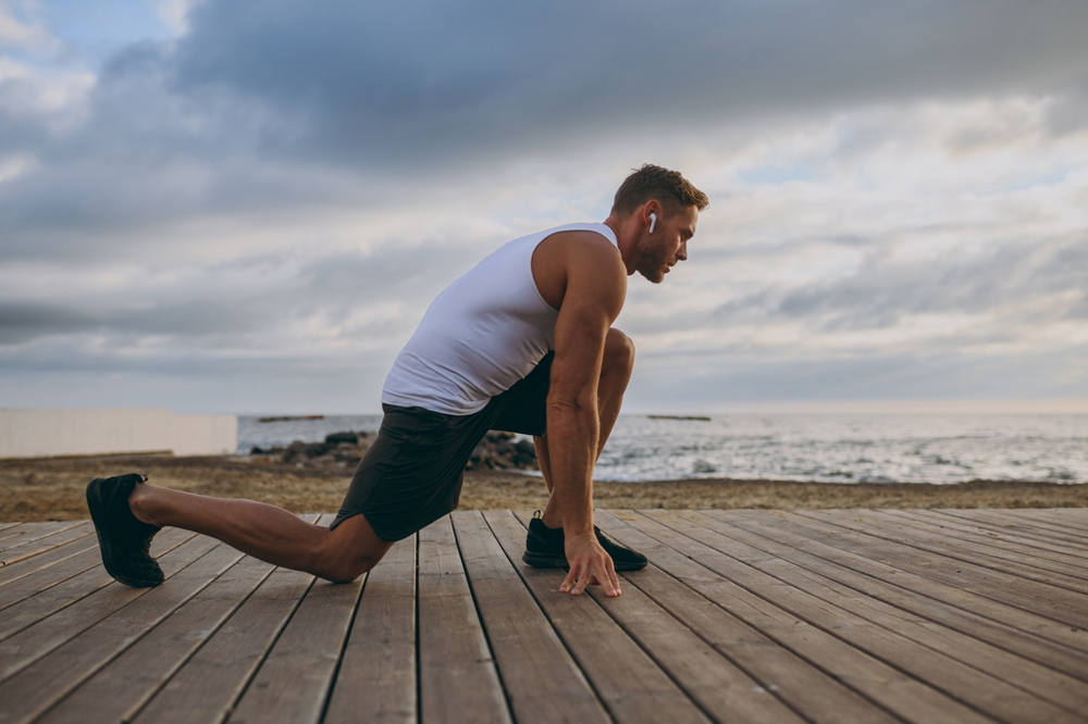 Man stretching outdoors beside calf implant recovery timeline from early walking to moderate activity.